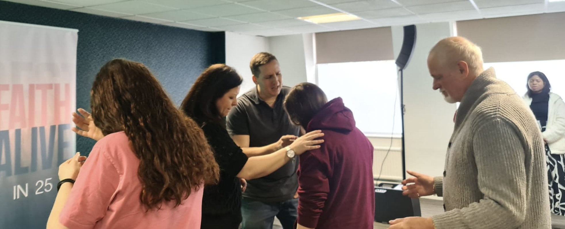 People praying together at Faith Life Preston