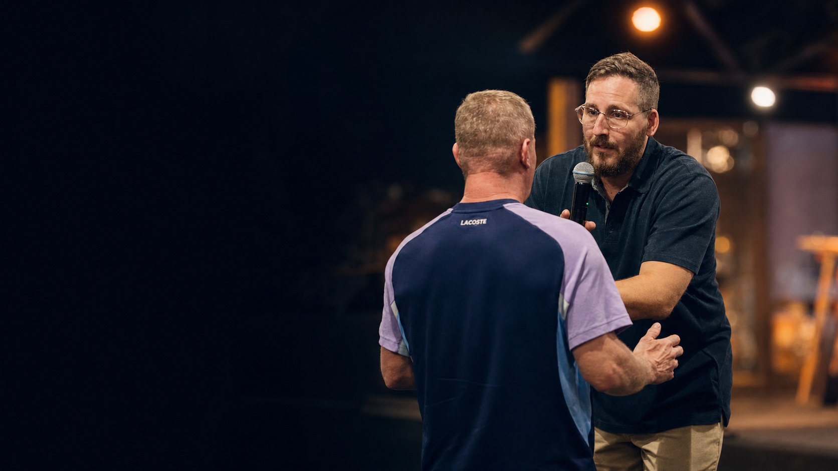 Andy Schofield ministering to someone in person
