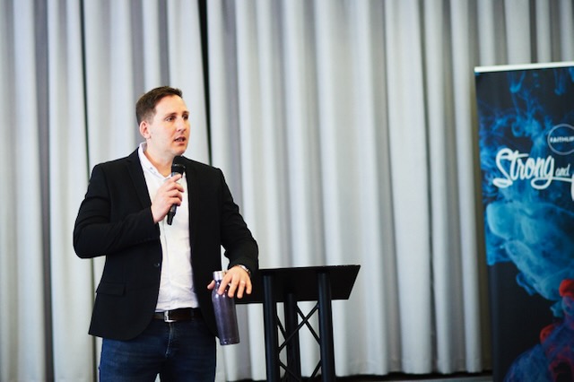 Andy Schofield preaching in a church setting